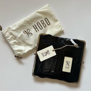 HOBO Lauren clutch-wallet black with wanderlust lining NWT